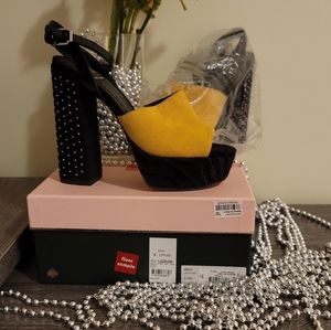 A women's Canary and Black  studded Dolce Vita platdorm size 9 1/2.